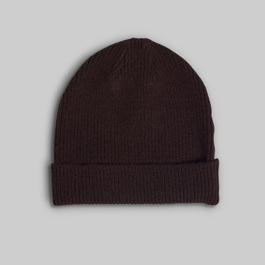 A dark brown ribbed knit beanie hat with a folded cuff, shown against a solid light gray background.