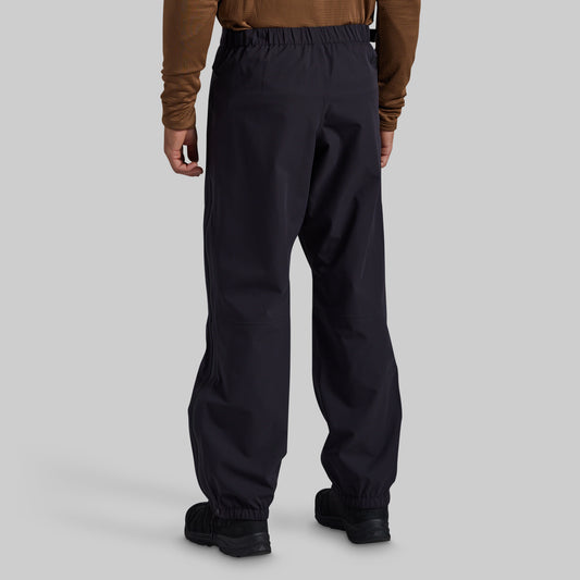Man wearing black Mission FLEX Rain Pant 2.0, back view