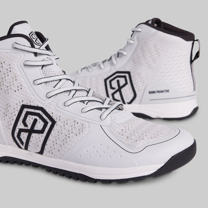 White high-top sneakers with black logos on a light gray background