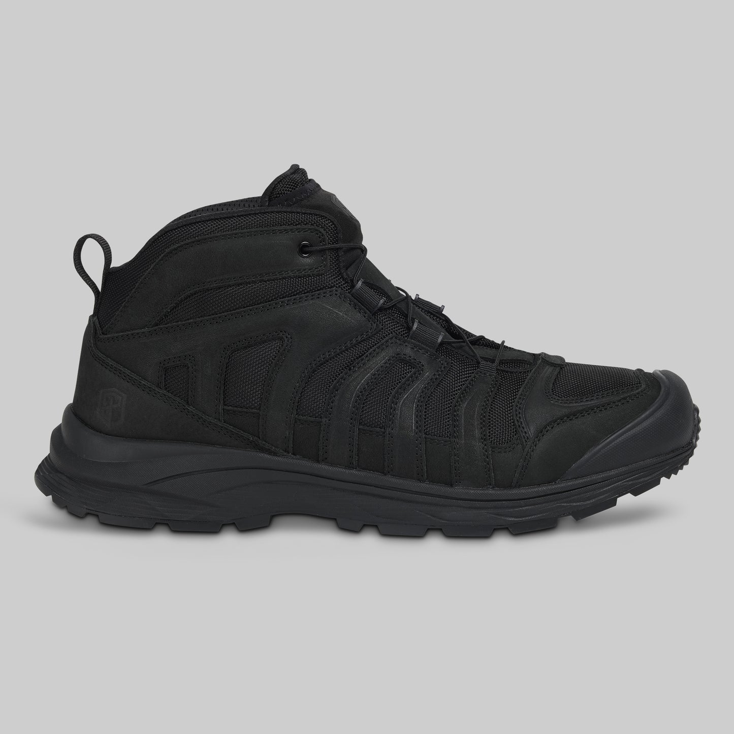 Black boot on a gray background