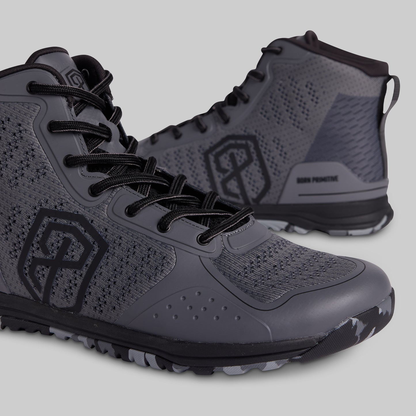 Gray high-top sneakers with black accents on a light gray background