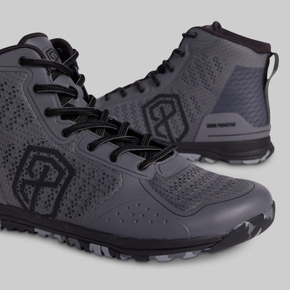 Gray high-top sneakers with black accents on a light gray background