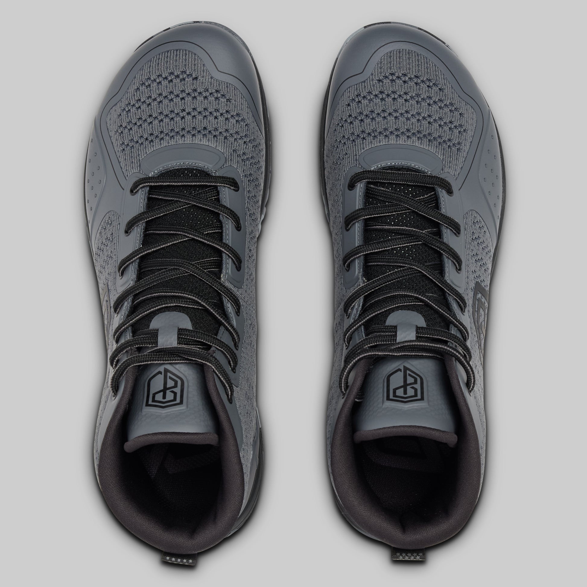 Pair of gray athletic shoes on a light gray background