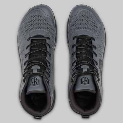 Pair of gray athletic shoes on a light gray background