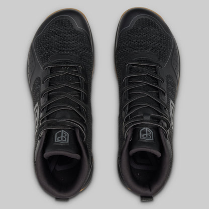 Black athletic shoes on a light gray background