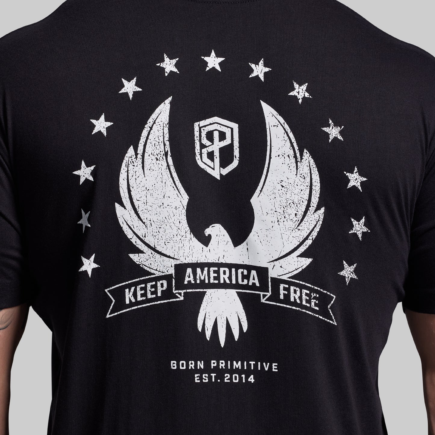 Black t-shirt with white graphic design featuring an eagle and stars on a gray background