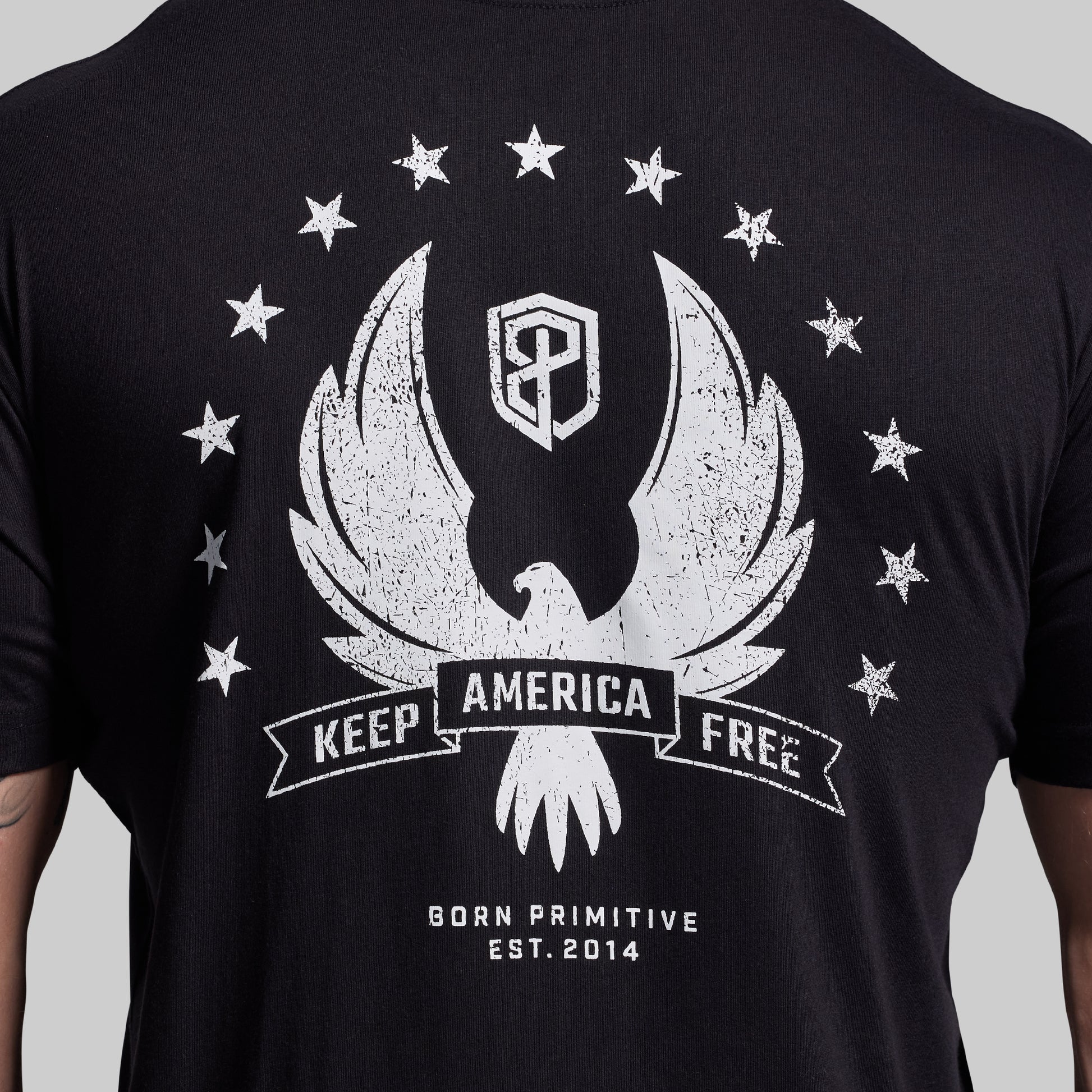 Black t-shirt with white graphic design featuring an eagle and stars on a gray background