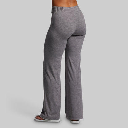 Gray sweatpants worn by a person on a light gray background