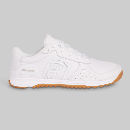 White sneaker with brown sole on a gray background