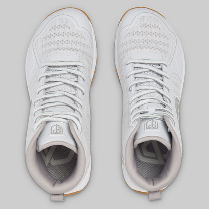 Pair of white sneakers on a light gray background