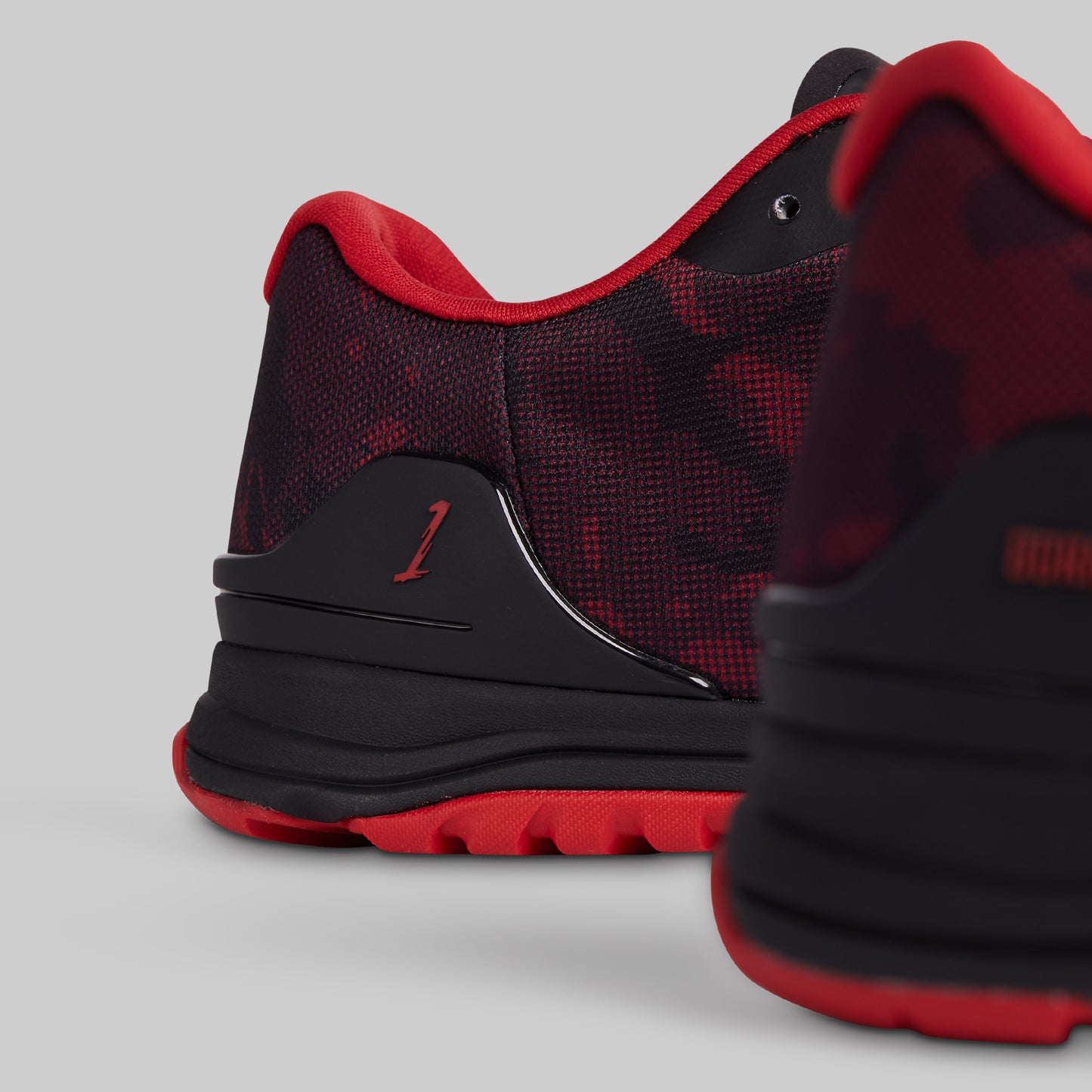 Black and red sneaker on a light gray background