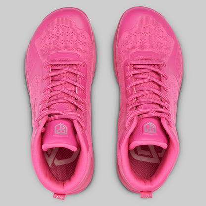 Pair of pink athletic shoes on a gray background