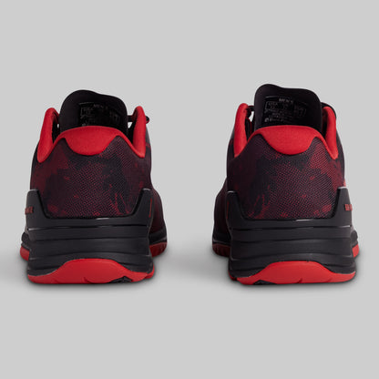 Black and red sneakers on a gray background
