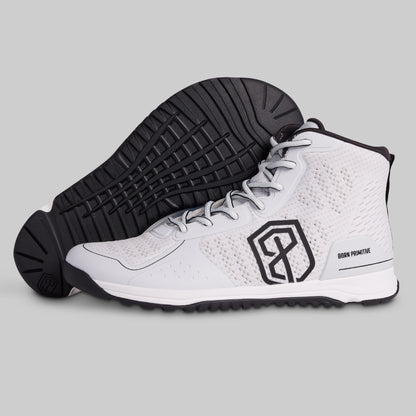 White high-top sneakers with black sole and logo on a gray background
