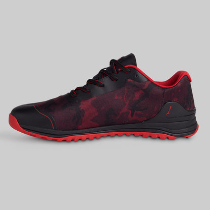 Black and red athletic shoe on a gray background