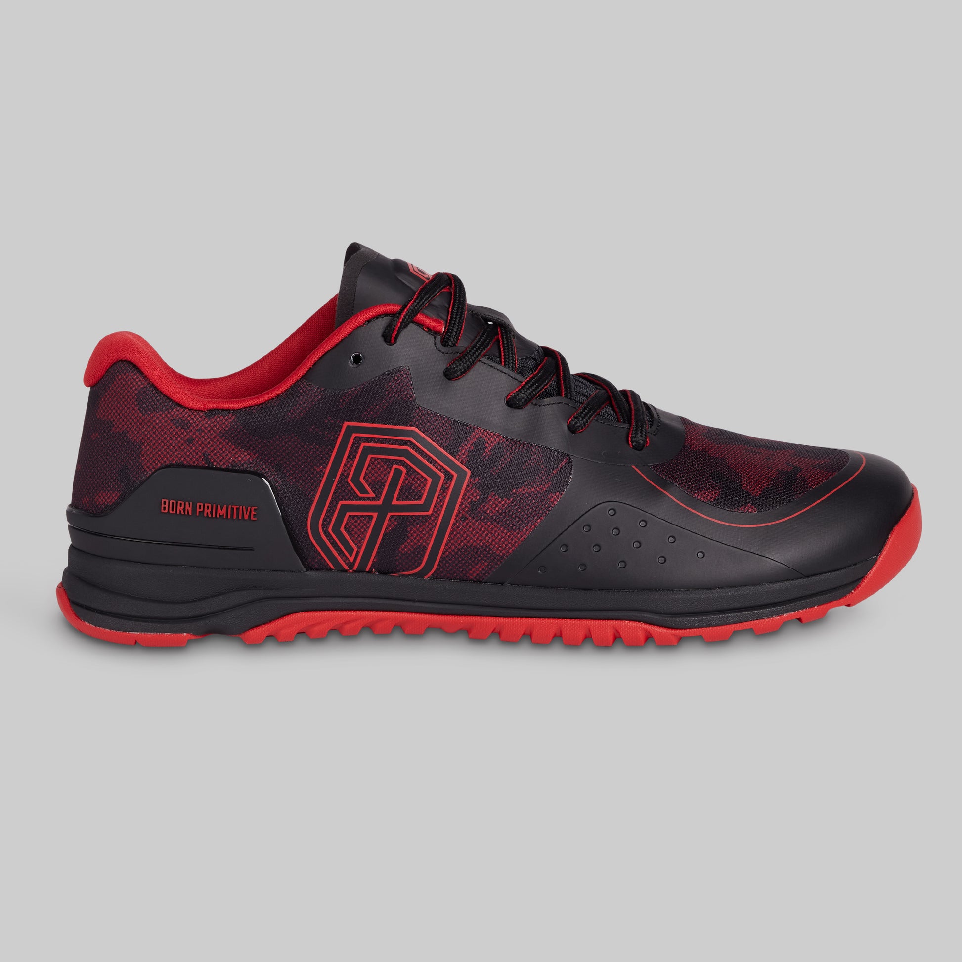 Black and red athletic shoe on a gray background