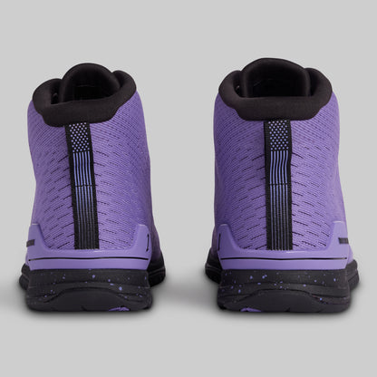 Purple high-top sneakers with black accents on a gray background