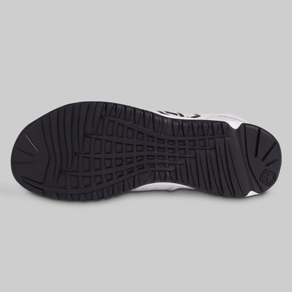 Black and white sneaker sole on a gray background