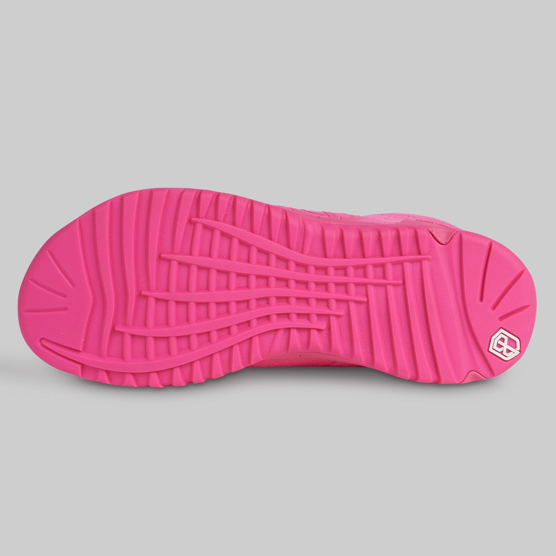 Close-up of a pink shoe sole with a brand logo on a gray background