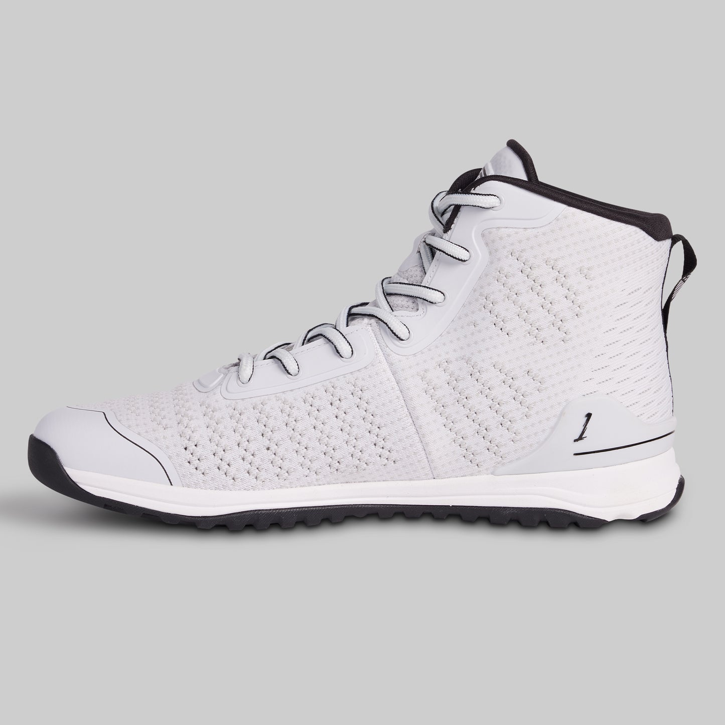 White high-top sneaker with black accents on a gray background