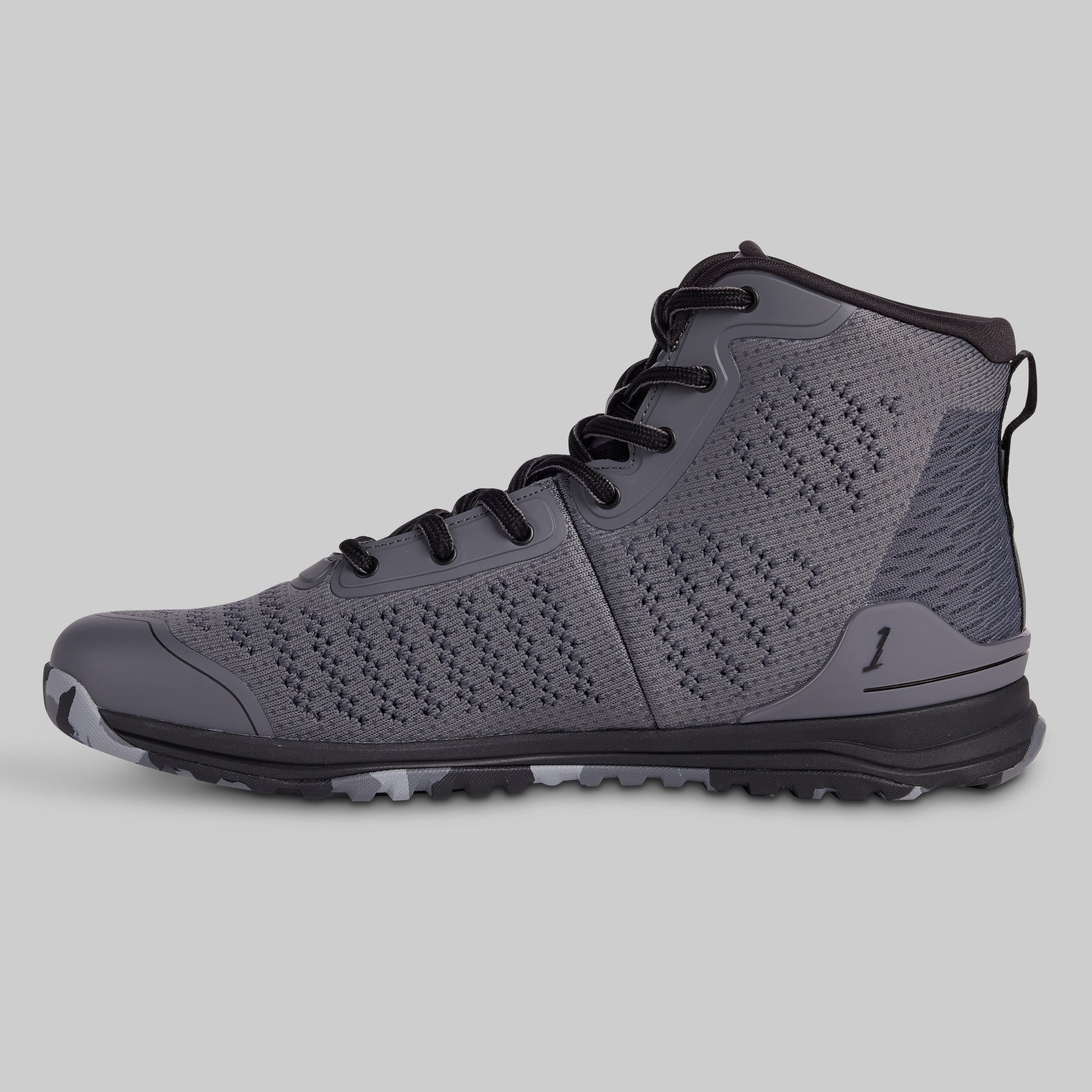 Gray high-top sneaker with black laces on a light gray background