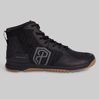 Black high-top sneaker with a brown sole on a gray background
