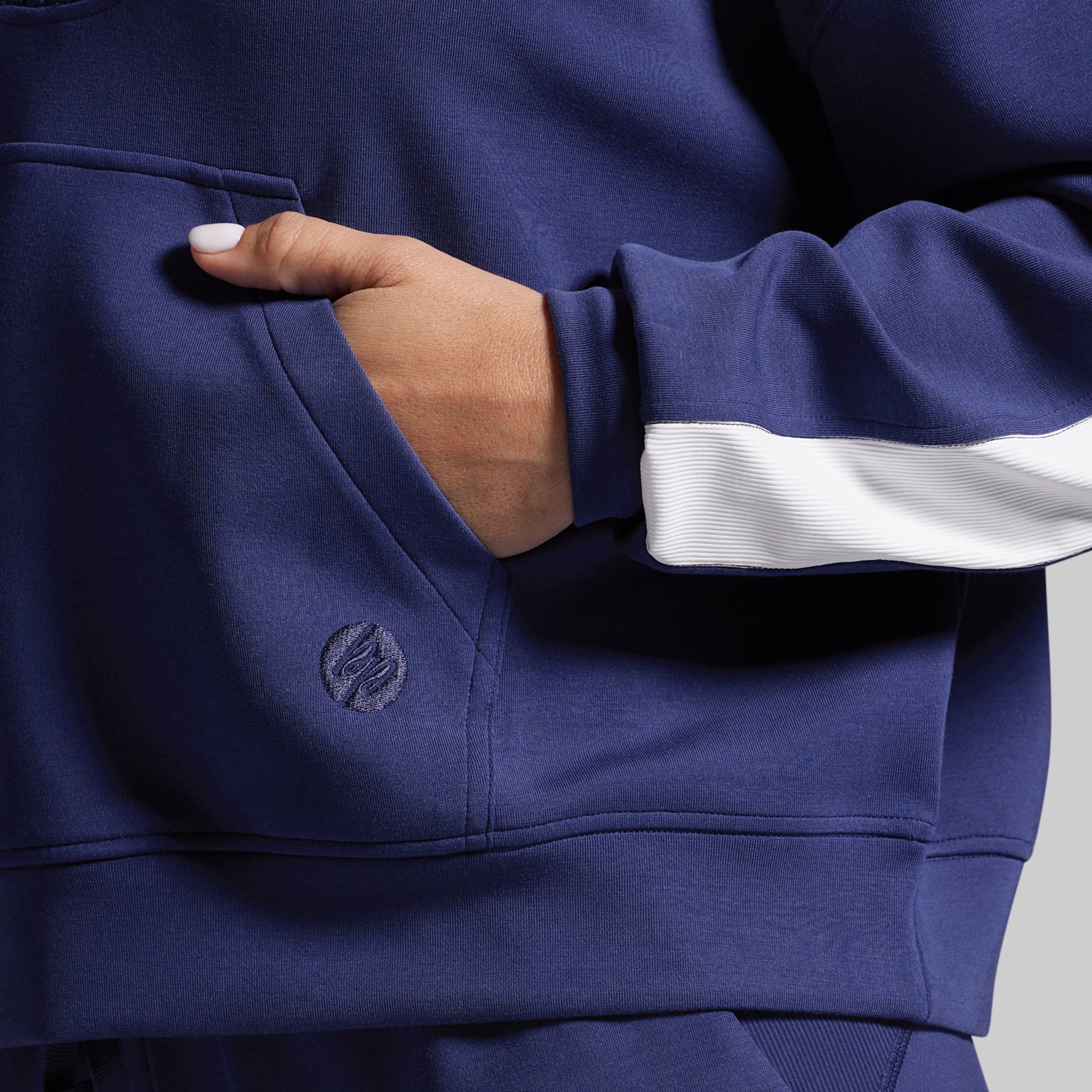 Close up of logo on a blue sweatshirt.