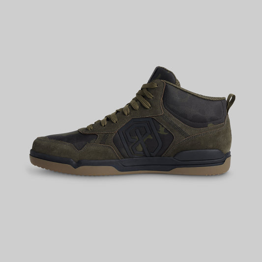 Brown sneaker with black accents on a white background