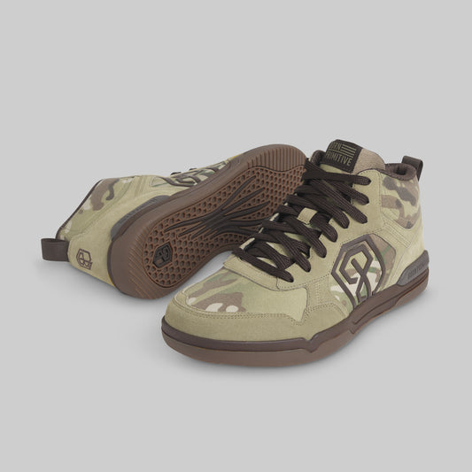 A pair of mid-top sneakers in a beige and brown camouflage pattern, featuring dark brown laces, a brown outsole, and a large stylized 'BP' logo on the side, displayed against a solid gray background.