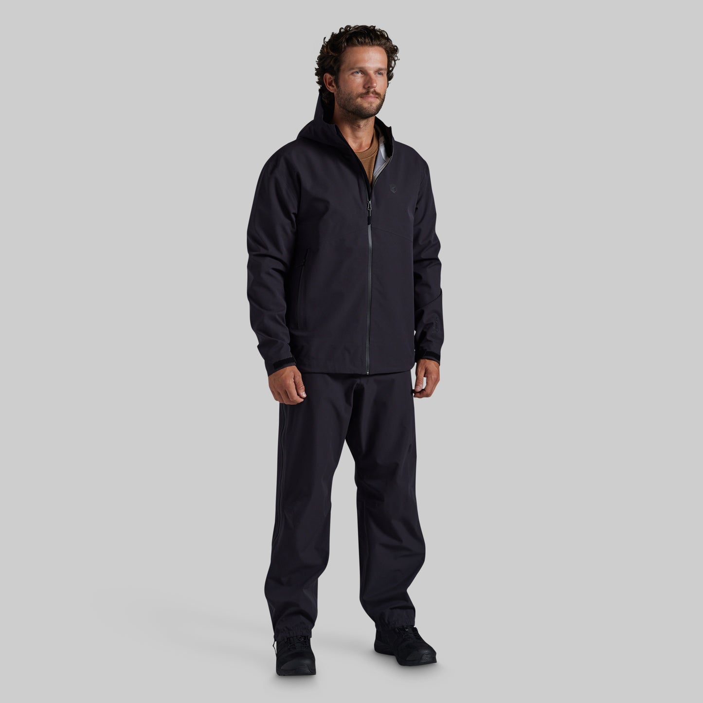 Full front view of black Mission FLEX Rain Pant 2.0 with matching rain jacket