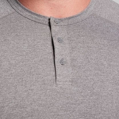 Close-up of a gray henley shirt with button details