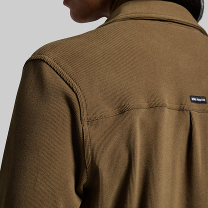 Brown corduroy button-up with a brand label on a gray background