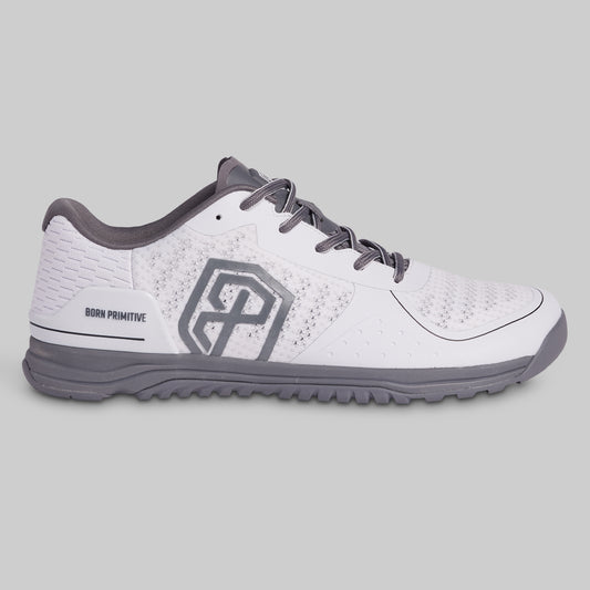 White and gray athletic shoe on a light gray background