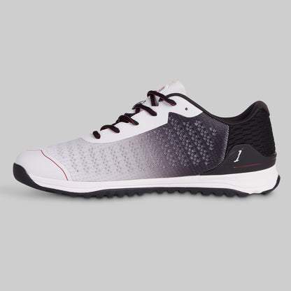Athletic shoe with white, black, and gray gradient on a gray background