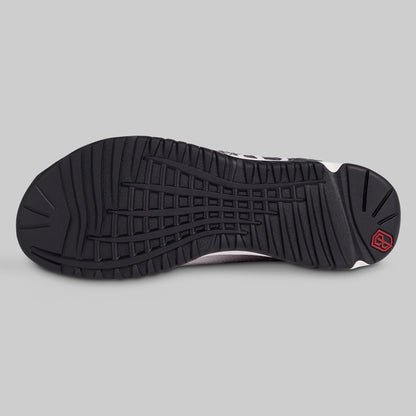 Black sole of a sneaker on a gray background
