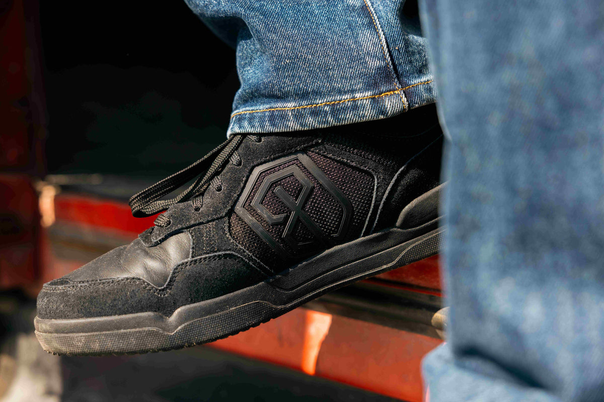 Black Urban Recon 1 standing on a truck running board 