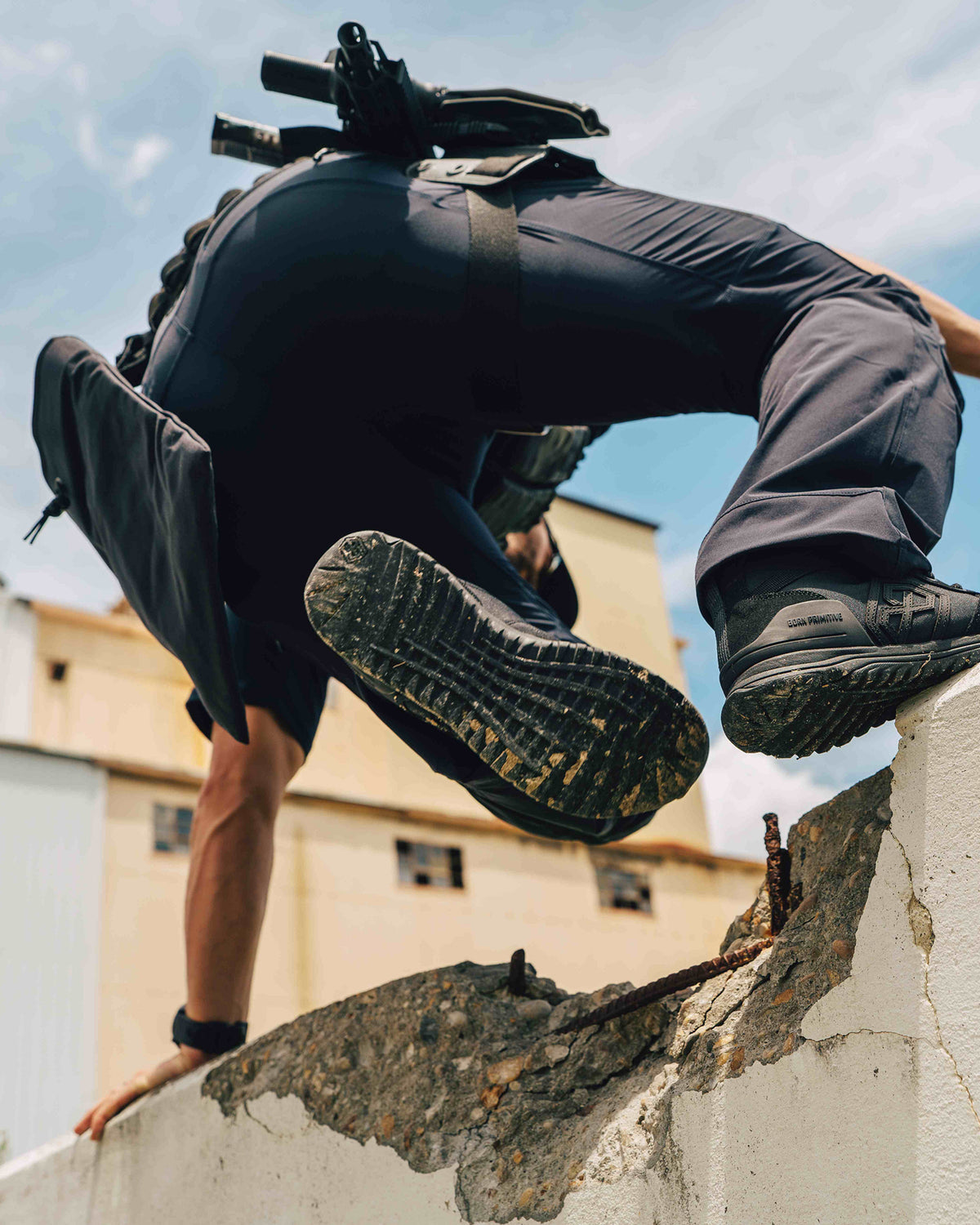 Defender 1 duty boot black being worn while scaling a wall 