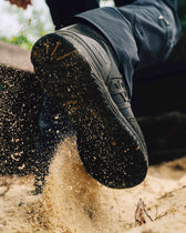 Defender 1 duty boot black being worn while running in sand 
