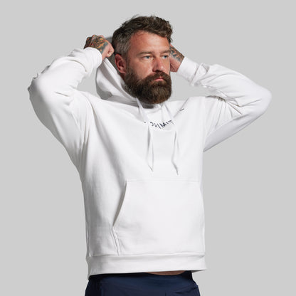 Man wearing a white hoodie with text on a gray background
