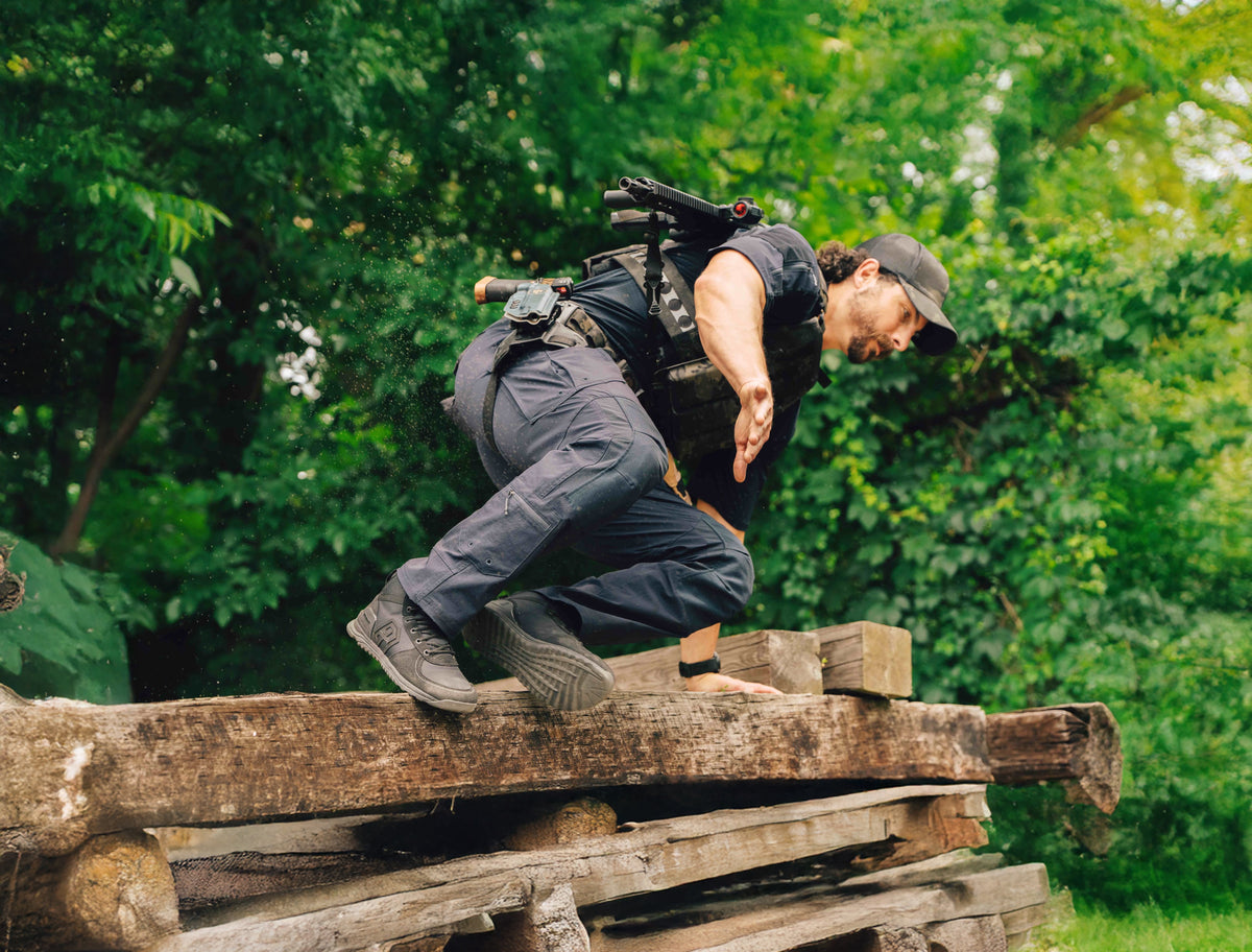 Defender 1 duty boot black being worn while jumping over an obstacle 