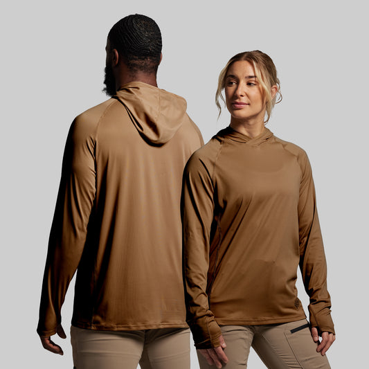 Two people wearing brown hooded sun shirts and pants against a gray background