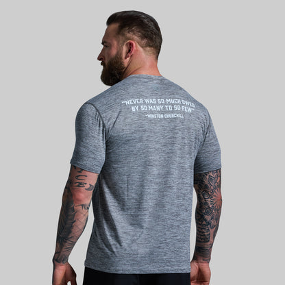 Man wearing a gray t-shirt with a quote on the back against a gray background