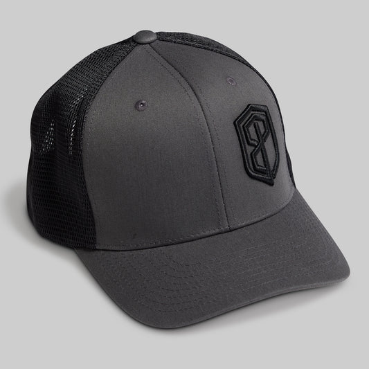 Gray cap with black mesh back and logo on a light gray background