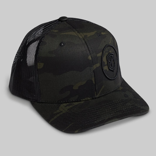 Black camouflage baseball cap with a logo on a gray background