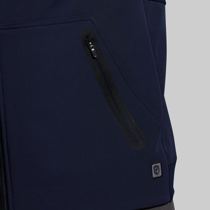 Navy blue hoodie with a zipper pocket on a gray background