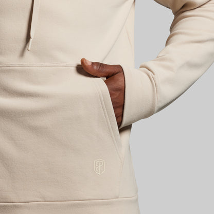 Beige hoodie with a brand logo on a light gray background