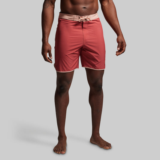 Person wearing red shorts on a gray background