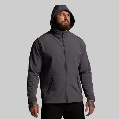 Man wearing a gray hoodie on a light gray background