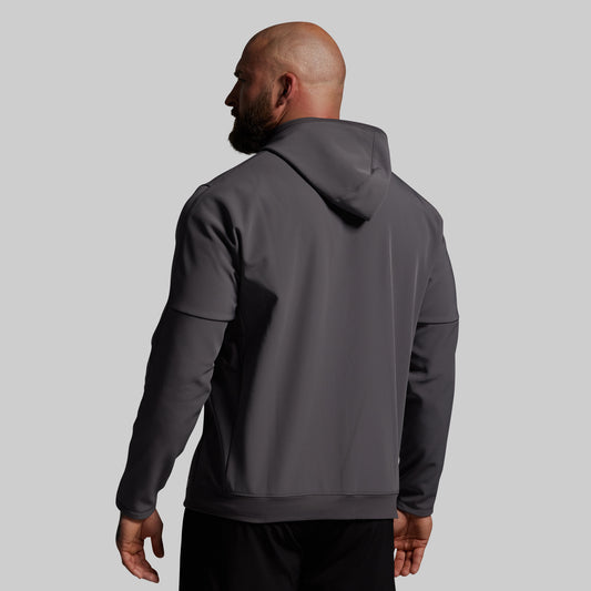 Man wearing a gray hoodie from behind on a light gray background