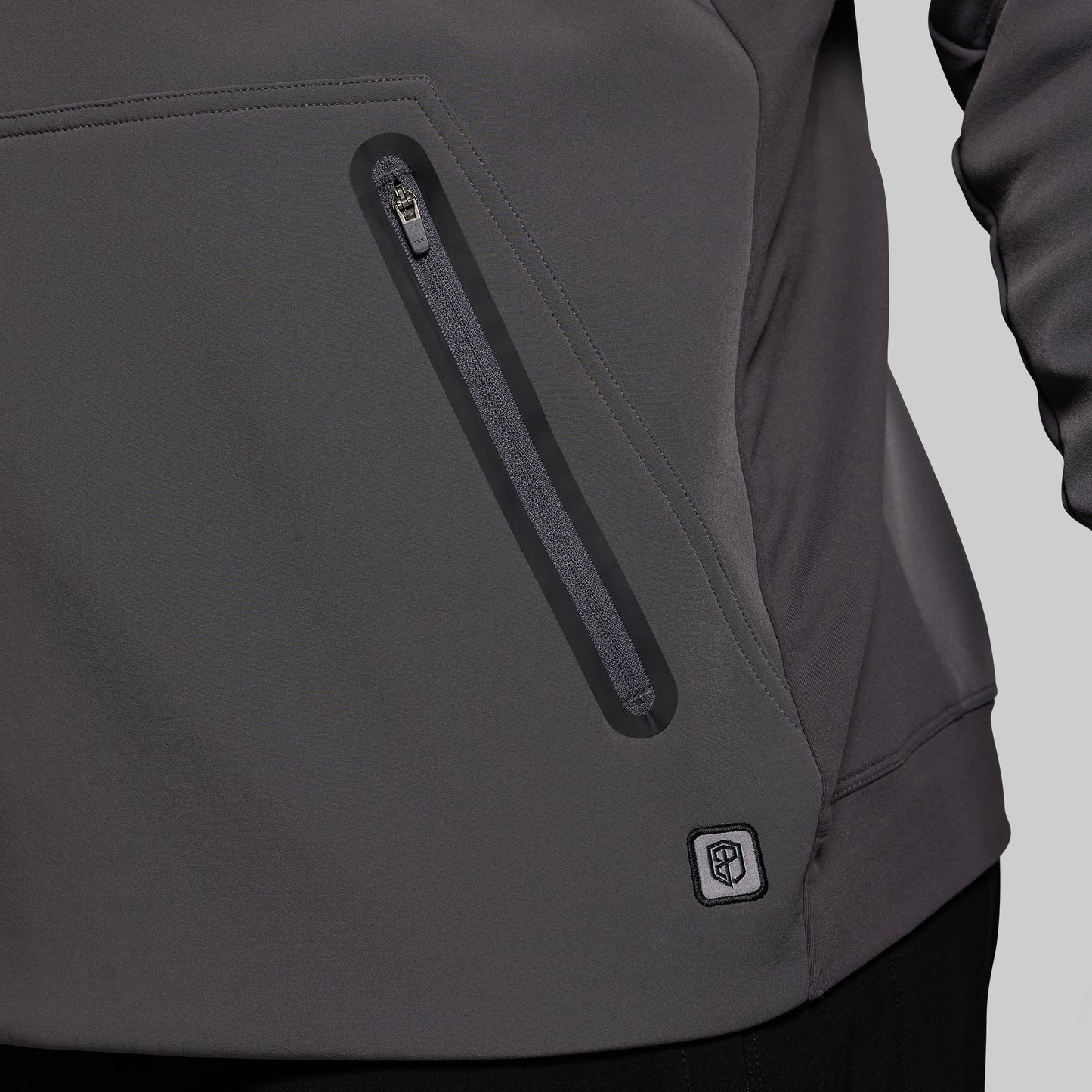 Gray jacket with a zipper pocket on a gray background